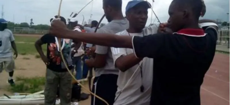 Young archers being coached on a range in Nigeria