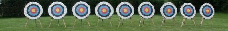 Row of archery targets on a field