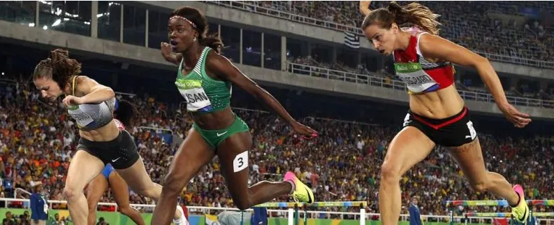 Sprinters racing on a stadium track