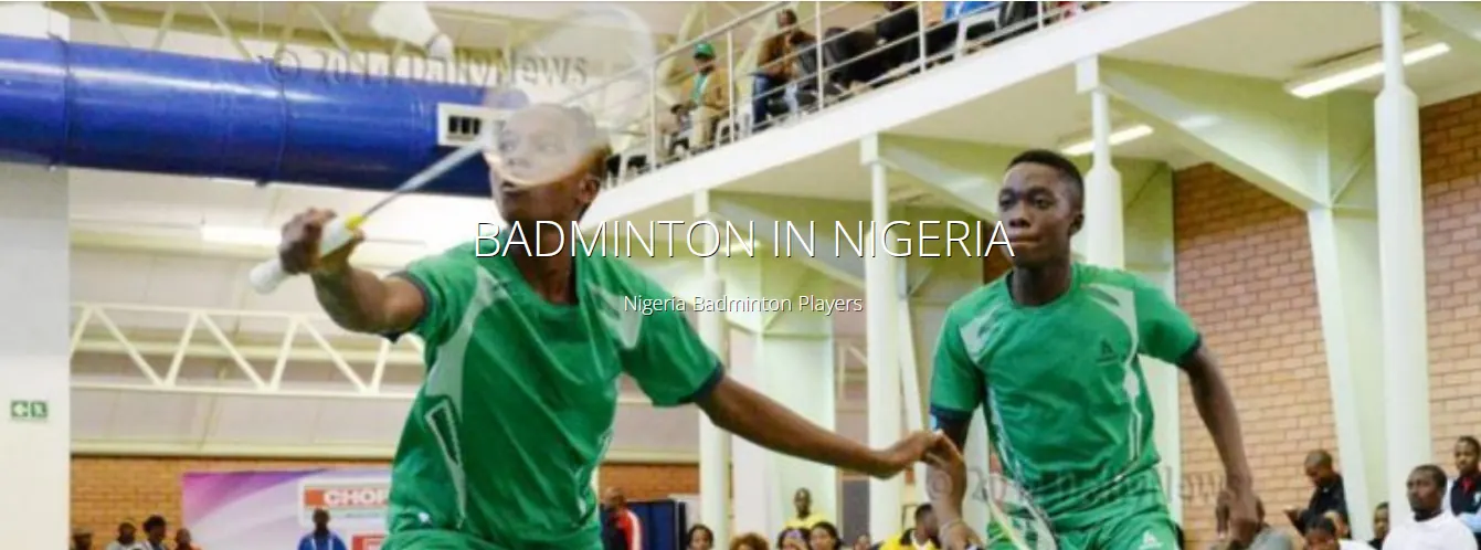 Nigerian badminton players in green playing doubles