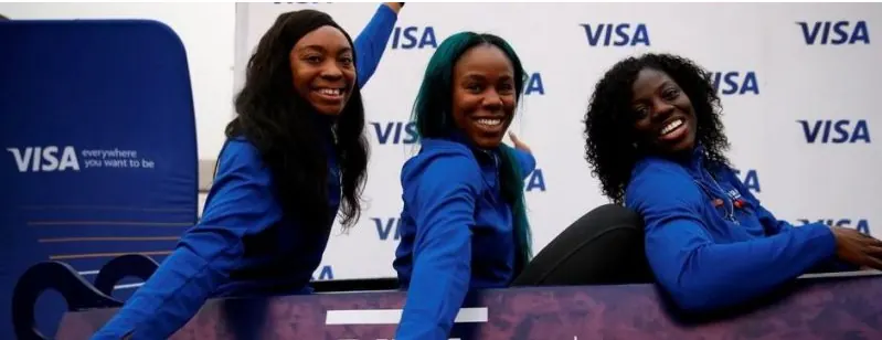 Nigeria's three 2018 bobsledders smiling at a sponsor's event
