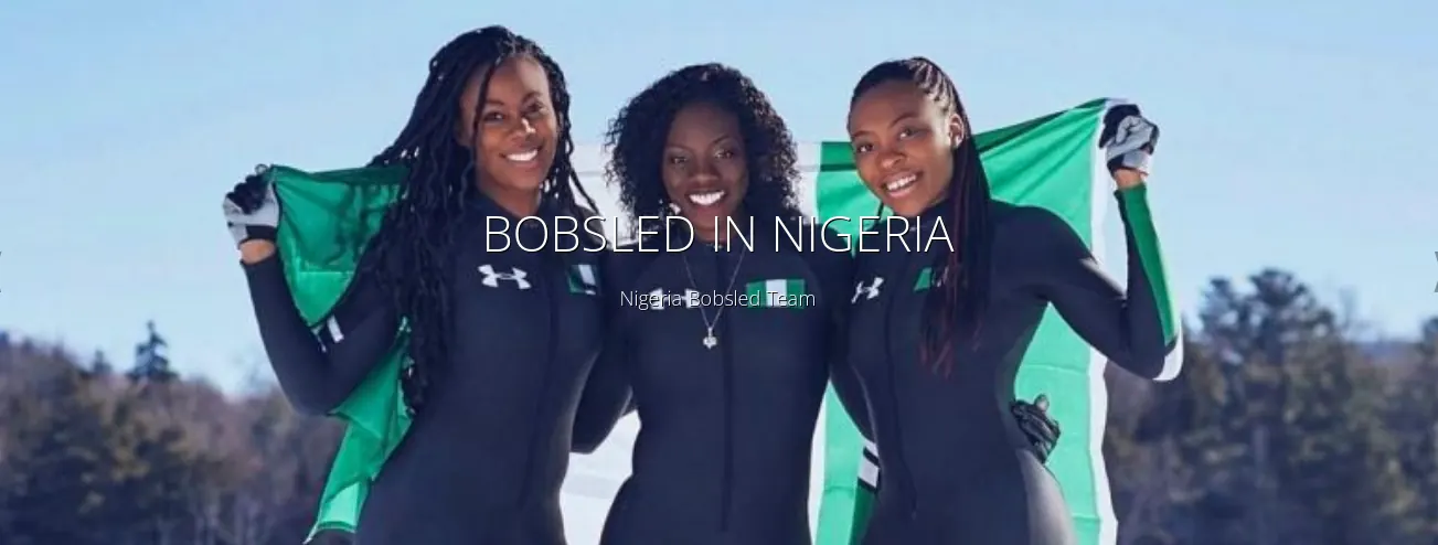 Nigeria’s bobsleigh team with the national flag in the snow