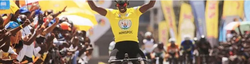 A rider in the leader&rsquo;s yellow jersey celebrating a stage win