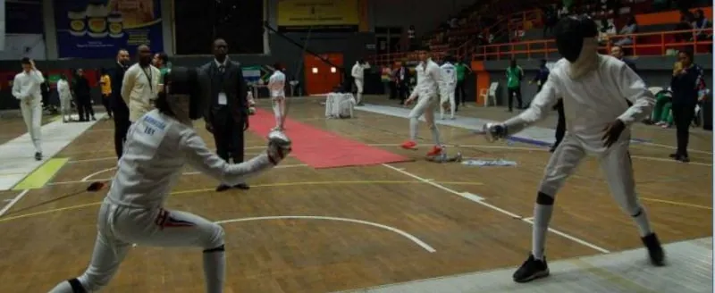 Fencers competing on the piste at a Nigerian championship