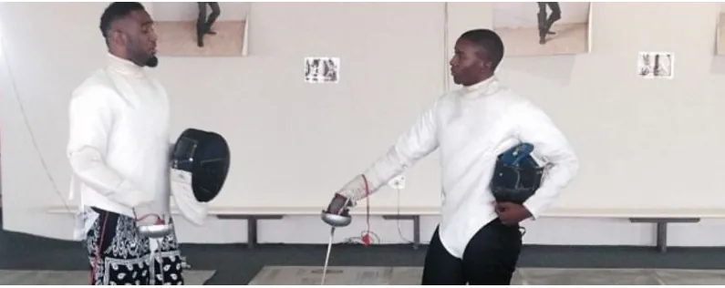 Two Nigerian fencers saluting before a bout