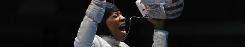 A fencer celebrating a winning touch