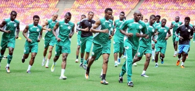 Super Eagles players jogging during a training session