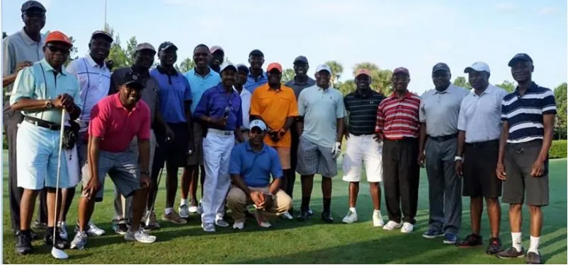 Members of a Nigerian golf club together on the course