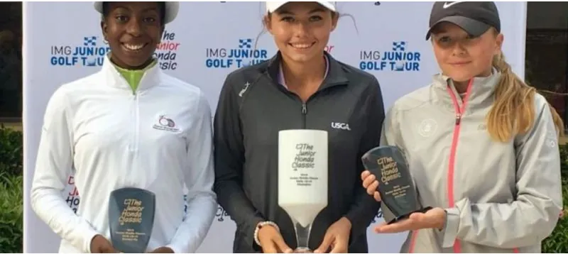 Junior golfers with their trophies at an international junior tour event
