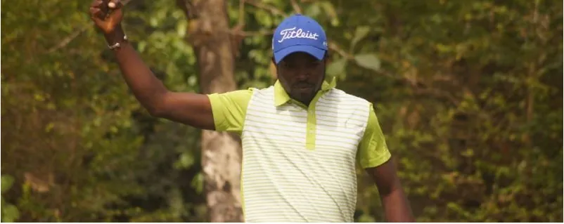 A Nigerian professional golfer acknowledging the crowd