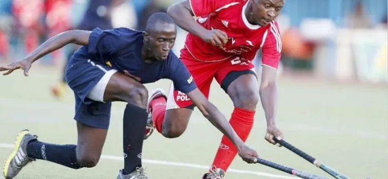 A Nigerian player sprinting past a defender