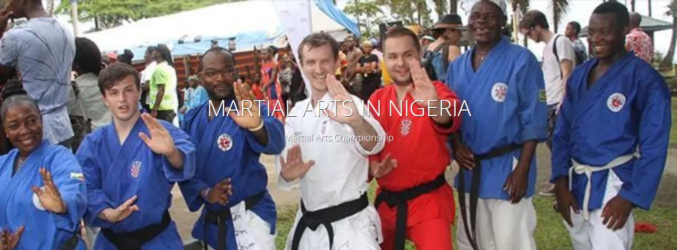 Nigerian and visiting martial artists in uniform at a championship in Nigeria