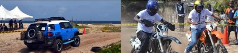 A 4x4 and dirt bikes competing at a beach motorsport event