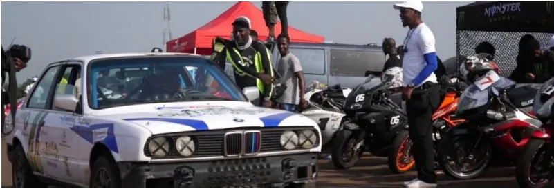 Rally cars and superbikes lined up at a Nigerian motorsport event