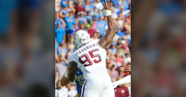 Nnamdi Madubuike, then at Texas A&M, pressuring the quarterback