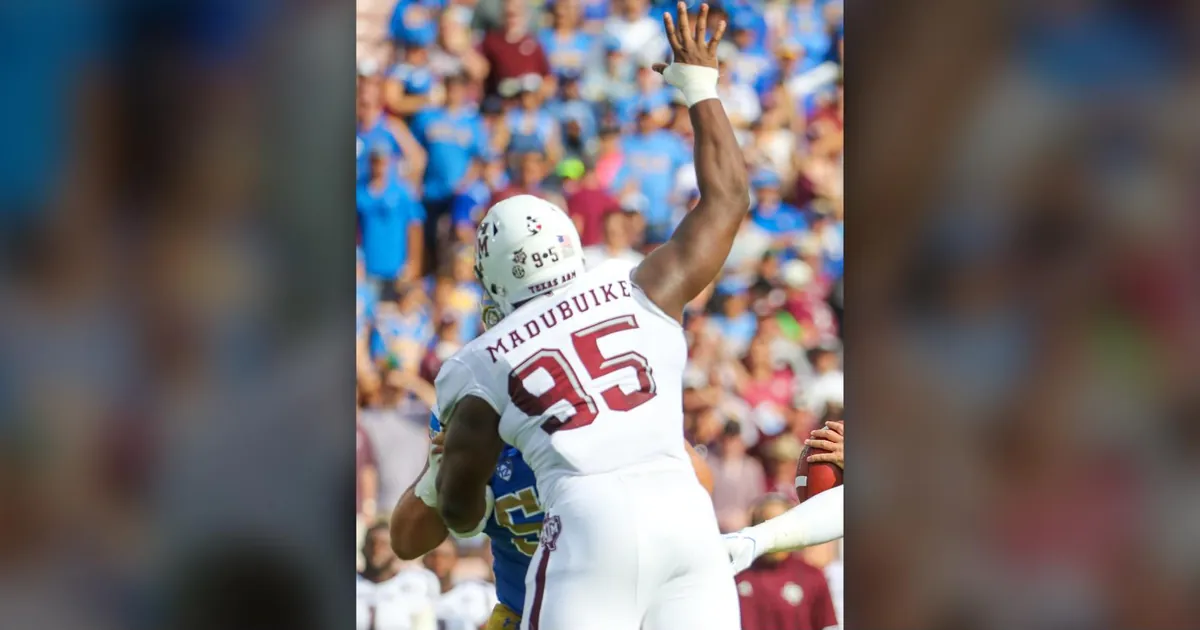 Nnamdi Madubuike, then at Texas A&M, pressuring the quarterback