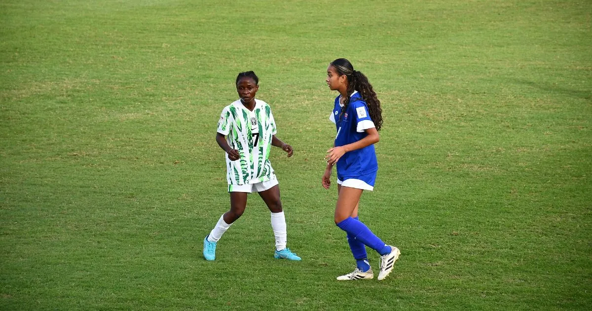 A Nigerian Under-17 player in green and white alongside a Samoa player
