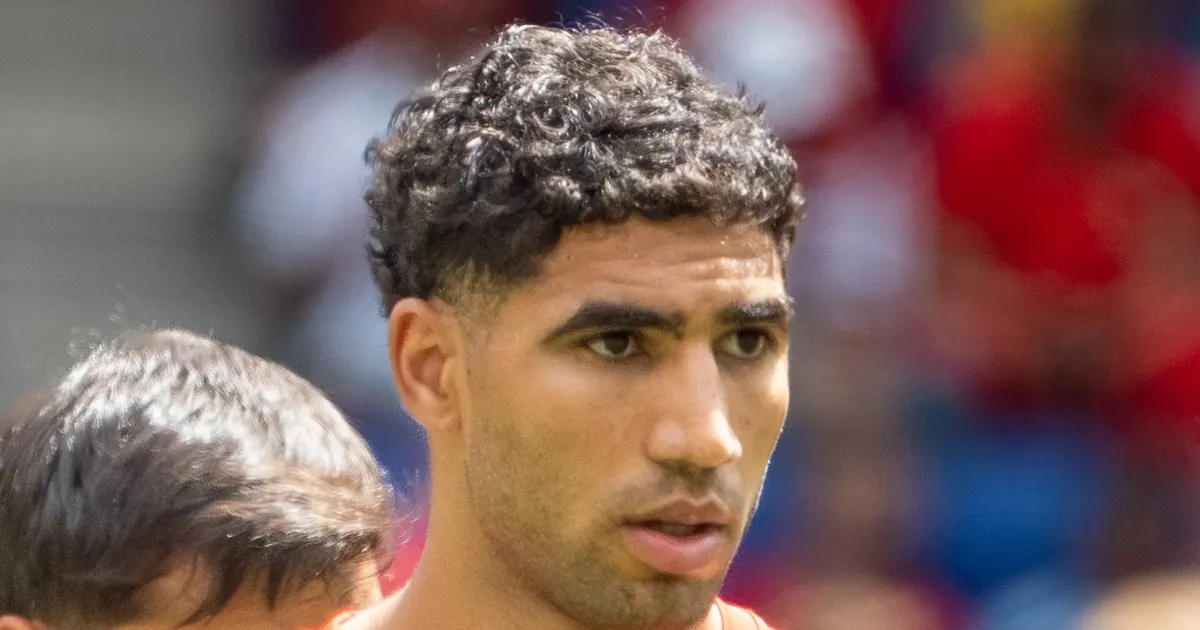 Achraf Hakimi in a red Morocco shirt during a match
