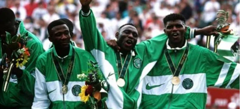 Nigerian Olympic medallists celebrating in green and white