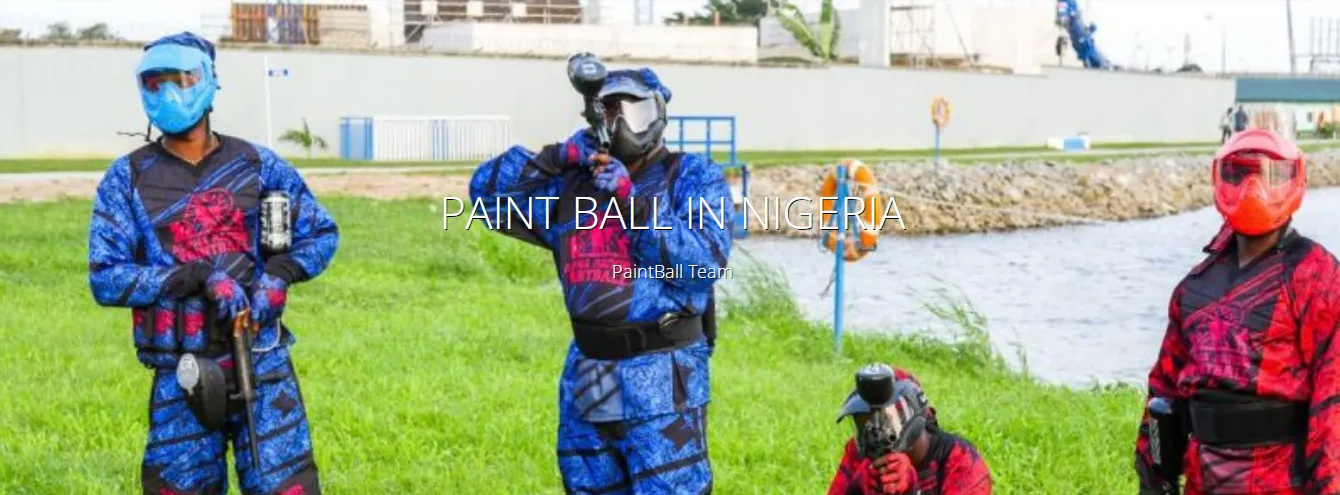 Nigerian paintball players in full gear by the lagoon
