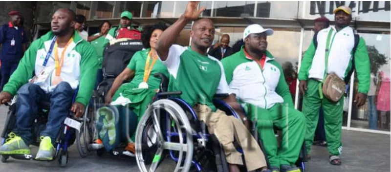 Nigerian Paralympians in team kit with their medals