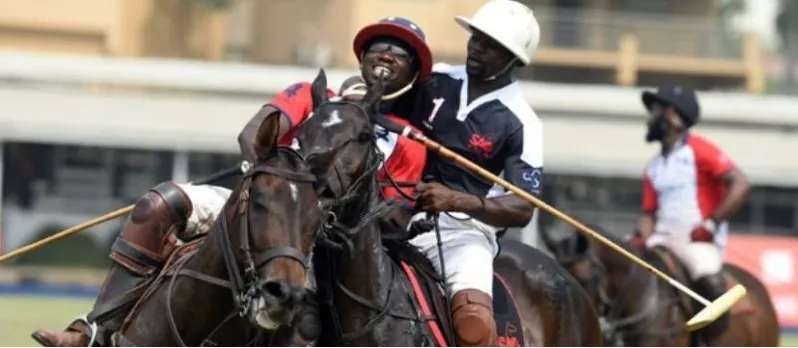 Polo players jostling for the ball at a Nigerian club
