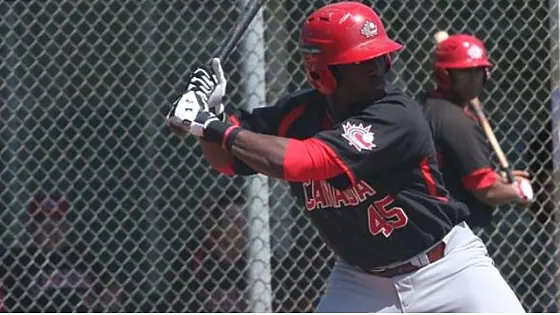 Nigerian baseball batter waiting for the pitch
