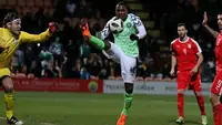 Super Eagles player striking the ball