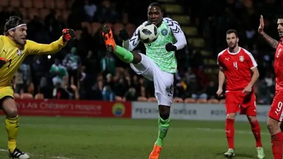 Super Eagles player striking the ball during an international match