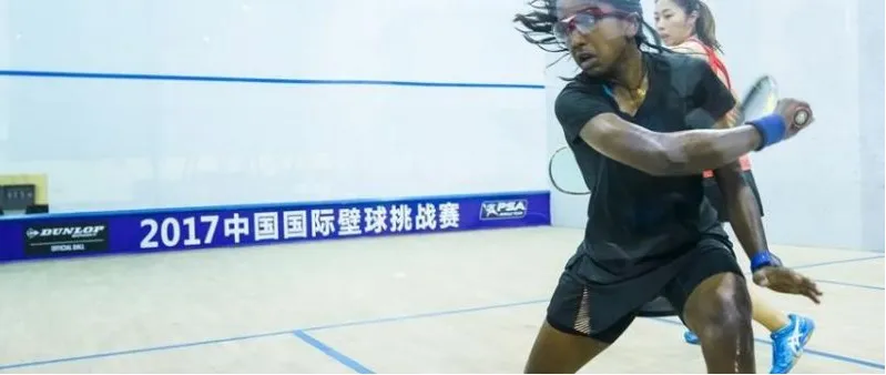 A Nigerian woman playing a forehand at an international PSA event