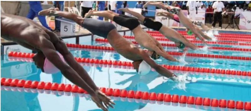Swimmers diving in at the start of a race
