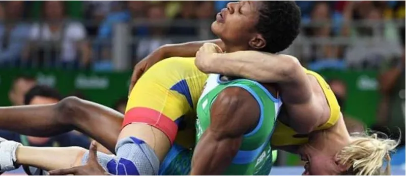 A Nigerian wrestler in a tight clinch